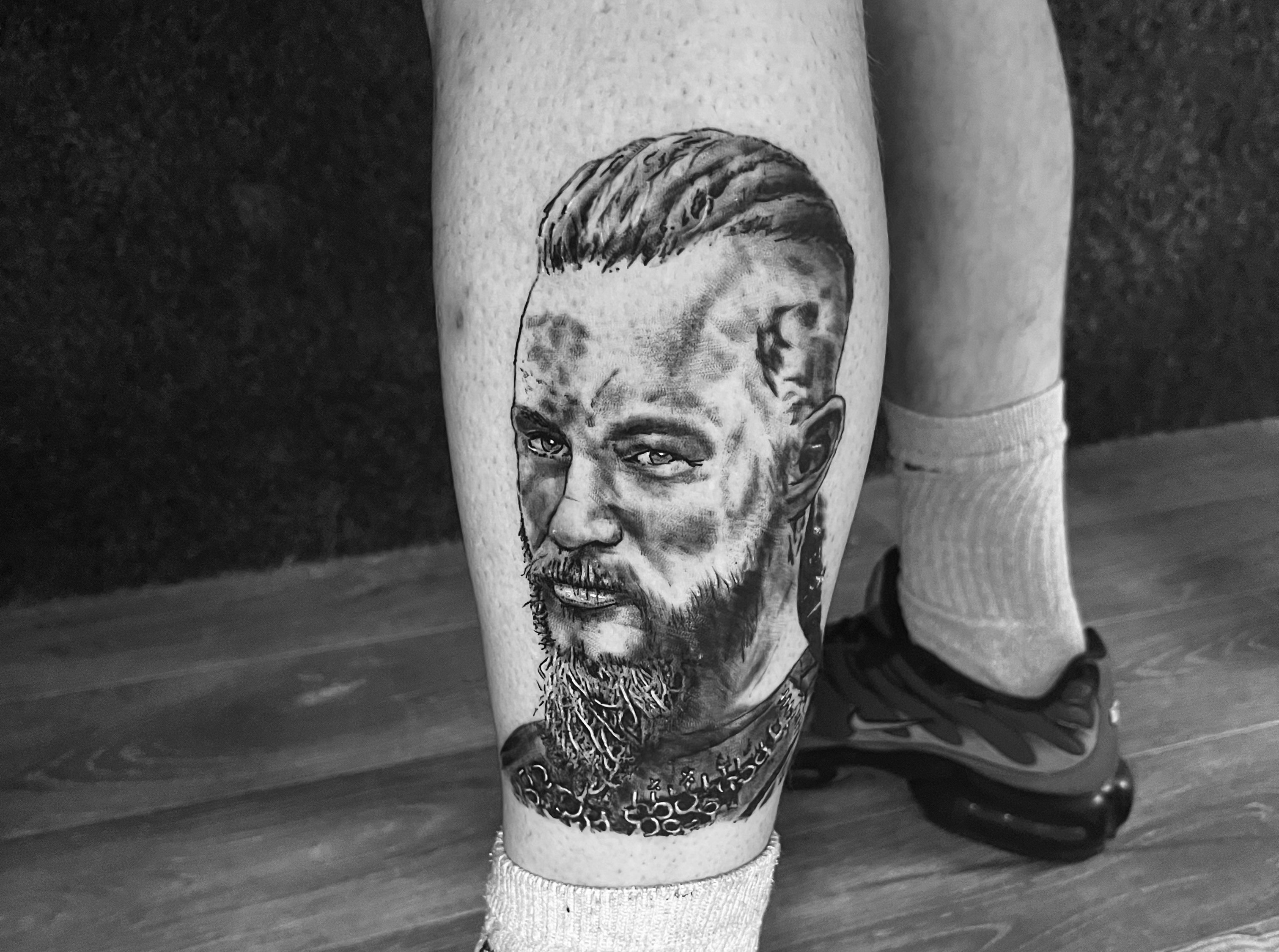 Black and grey realism portrait tattoo close up